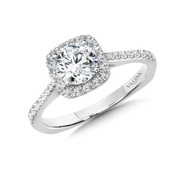 Diamond halo engagement ring mounting in 14k white gold.