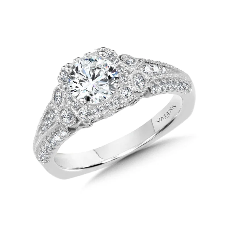 Diamond halo engagement ring mounting in 14k white gold.