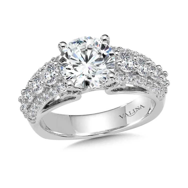 Diamond engagement ring mounting with diamond side stones set in 14k white gold.